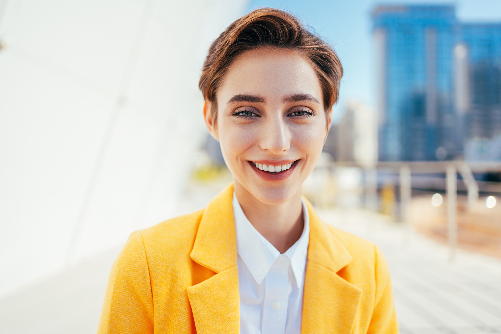 Beautiful young woman with short hair in the city